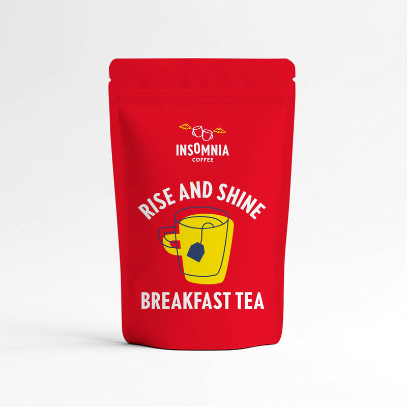 A red stand-up pouch of Insomnia Coffee Breakfast Tea with a yellow mug graphic and white text, set against a clean white background.